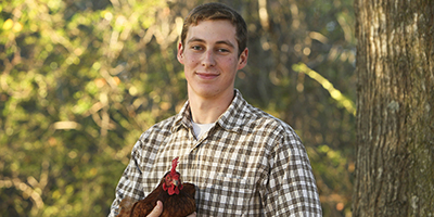 Man holding a hen